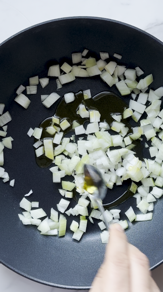 chicken korma with diced onions and oil